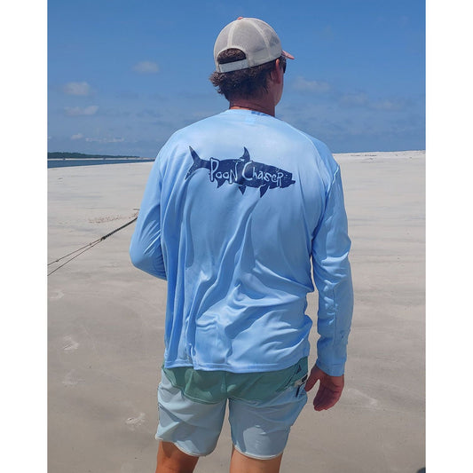 Model wearing light blue long sleeve Tarpon "Poon Chaser" performance fishing shirt with 50+ UPF sun protection