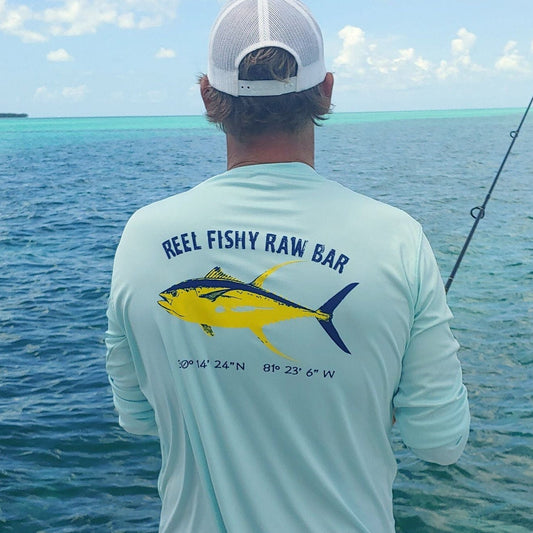 Fisherman wearing Reel Fishy Raw Bar Tuna Performance Dry-Fit Long Sleeve - Seagrass