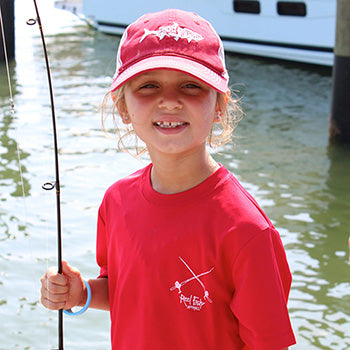 Youth Girl Modeling Reel Fishy Performance Shirt and Hat