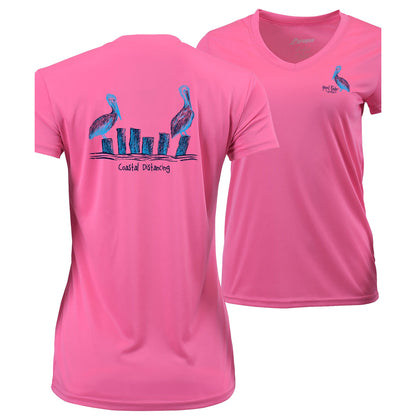 Women’s bright pink short sleeve performance shirt, V-neck, pelicans "coastal distancing" design on back, and Reel Fishy Pelican logo on front