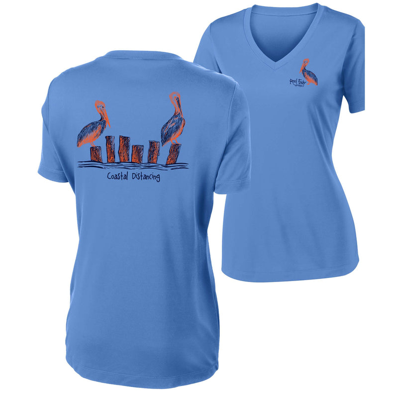 Women’s light blue short sleeve performance shirt, V-neck, pelicans "coastal distancing" design on back, and Reel Fishy Pelican logo on front