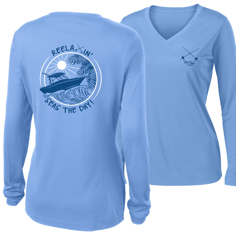 Ladies light blue long sleeve V-neck performance dry-fit shirt with Reelaxin’ – Seas the Day logo on the back and Reel Fishy Salt Rods logo on the front.