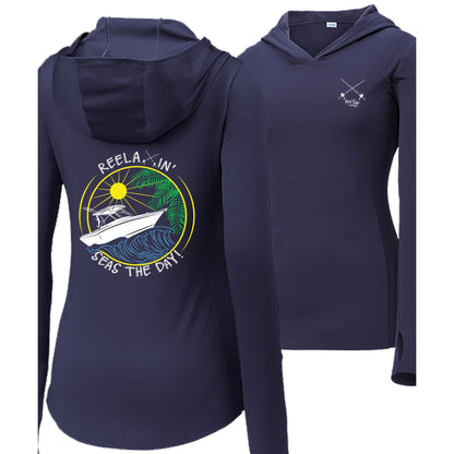 Women’s navy long sleeve performance hoodie, thumb holes, fishing boat and Seas the Day graphic, Reel Fishy salt fishing rods logo on front.