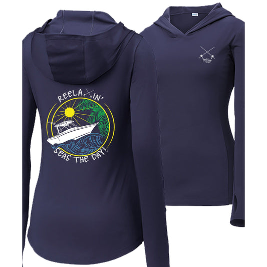 Women’s navy long sleeve performance hoodie, thumb holes, fishing boat and Seas the Day graphic, Reel Fishy salt fishing rods logo on front.