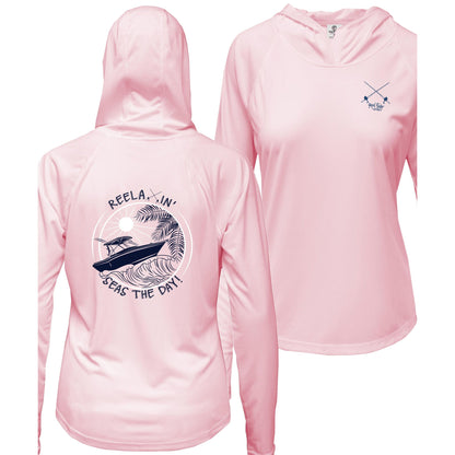 Ladies pink long sleeve performance hoodie, thumb holes, fishing boat and Seas the Day graphic, Reel Fishy salt fishing rods logo on front.