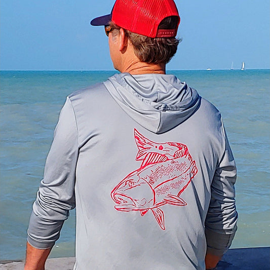 Model wearing light gray Redfish dri-fit 50+ sun protection short sleeve hoodie