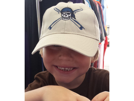 Youth wearing khaki fishing hat with Reel Fishy Pirate Skull and Rods logo

