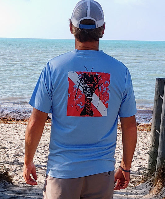 Model wearing Lobster Performance light blue short sleeve fishing shirt with 50+ UPF sun protection and "Bug Tickler" dive logo